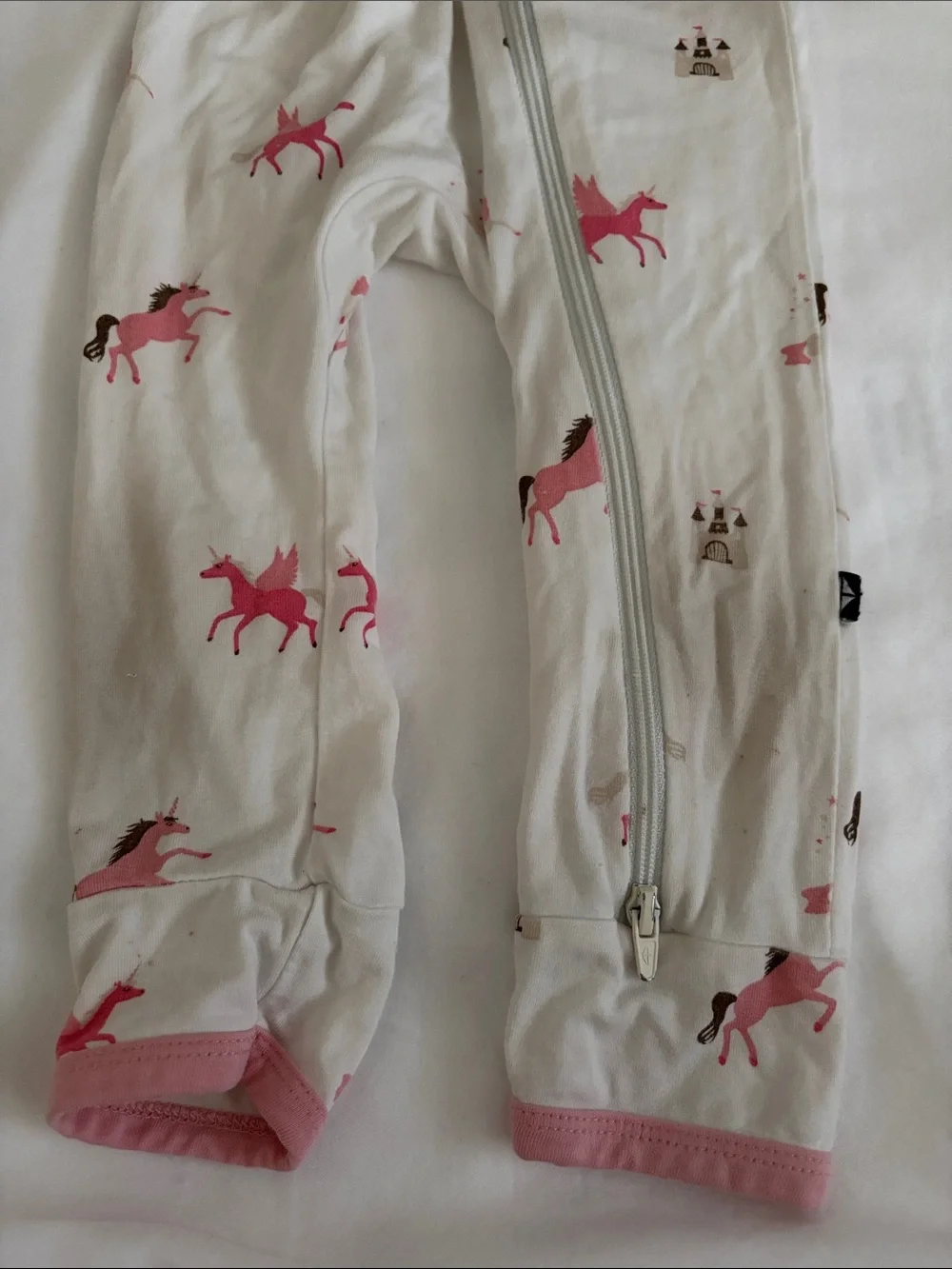 Kyte Baby pink and white unicorn castle print zippy